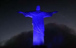 Christ statue blue light dark - a dark sky behind free wallpaper