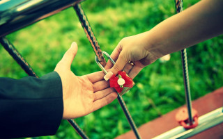 Person handing red string bike - a red box free wallpaper