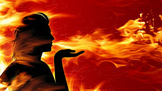 Woman silhouette fire background hand - the side of her face free wallpaper