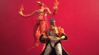 Statue man sword demon red - a red wall behind free wallpaper