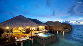 Resort pool thatched huts night - hut free wallpaper