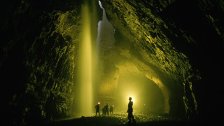 Cave people waterfall light ceiling - atmospheric free wallpaper for desktop