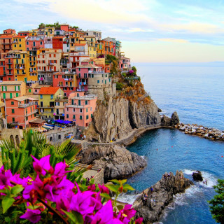 Colorful village cliff ocean purple - free landscape wallpaper for tablet