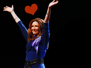 Woman blue top arms up - a blue top free wallpaper