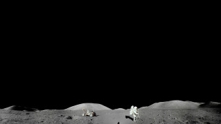 Astronauts moon walking black background - free space wallpaper