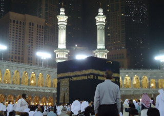 Man standing black gold building - mosaic free wallpaper