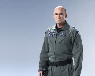 Man uniform studio photo gun - his hand and a helmet free wallpaper