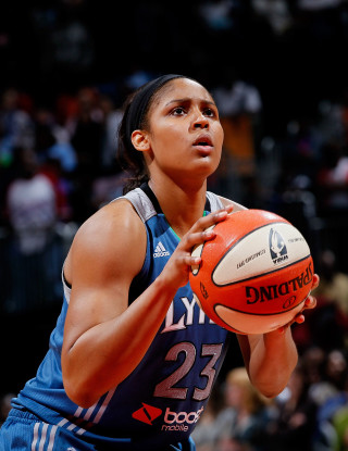 Woman holding basketball looking up - hand free wallpaper for mobile