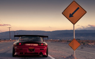 Red sports car road sign 2 - a road next free wallpaper