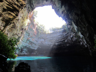 Cave blue pool light entrance - a blue pool in the middle of it free wallpaper