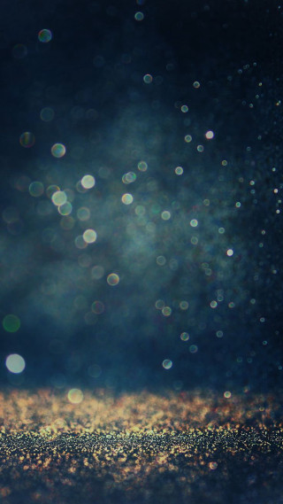 Gold glitter blurry sky background - a blurry photo free wallpaper for mobile