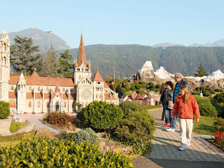 People building clocktower mountain tiltshift - florence engelbach free wallpaper for desktop
