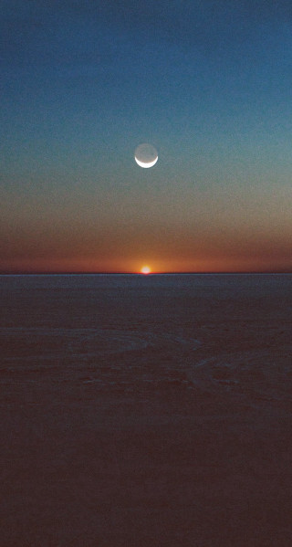 Sunset halfmoon distant moon ocean - a sunset free wallpaper for mobile
