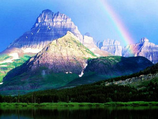 Rainbow mountain range distant scenery 2 - a rainbow in the sky free wallpaper