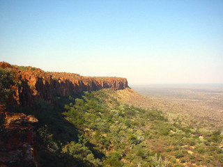 Valley trees cliff blue sky - a view of a valley free wallpaper