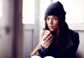 Woman sitting couch cigarette hand - a cigarette free wallpaper for desktop