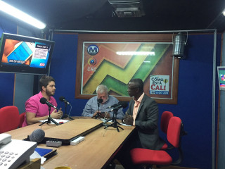 Man sitting table microphones another - another man free wallpaper