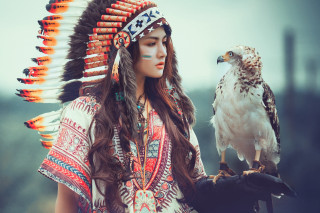 Woman native american headdress falcon - her hand and a bird free wallpaper