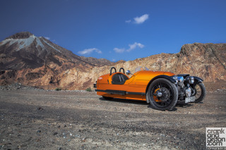 Orange motorcycle mountain range sky - free motorcycles wallpaper for desktop