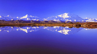 Mountain range reflection lake blue 6 - a blue sky in the background free wallpaper for desktop