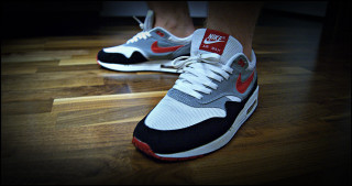 Person wooden floor sneakers red - a pair of sneakers free wallpaper