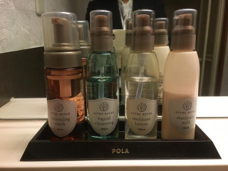 Personal care products bathroom counter - a man in the background free wallpaper