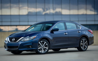 Blue car parked building sky - brian fies free wallpaper