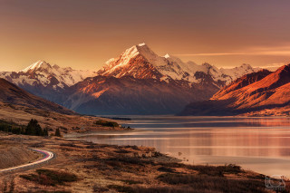 Scenic mountain range lake road - a scenic view of a mountain range free wallpaper