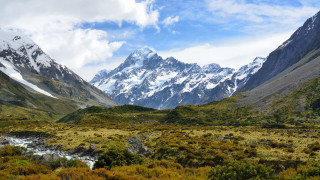 Mountain range stream snow capped - a stream free wallpaper for desktop