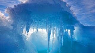Ice cave icicles blue sky - ecological art free wallpaper