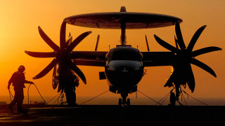 Man propeller plane field sunset - top of a field free wallpaper