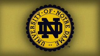 Unc logo wall yellow circle - a wall in a room free wallpaper