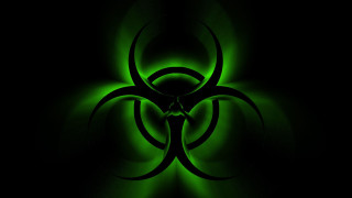 Green biohazard black background glow - a green glow free wallpaper