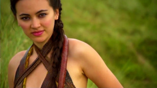 Woman braids grassy field camera - her hand and a camera free wallpaper