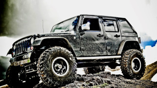 Black jeep rocky hill cloudy 2 - a black tire free wallpaper