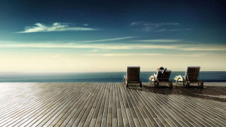 Two people sitting on chairs - the deck free wallpaper