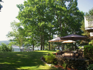 Patio tables umbrellas lake trees - a patio free wallpaper