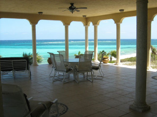 Patio table chairs ocean beach - a patio free wallpaper