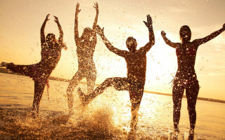 Jumping people sunset beach ocean - eric zener free wallpaper