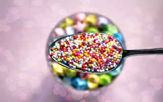Spoon filled colorful candy sprinkles - tablecloth free wallpaper