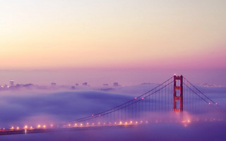 Foggy bridge city lights distant - volumetric fog free wallpaper