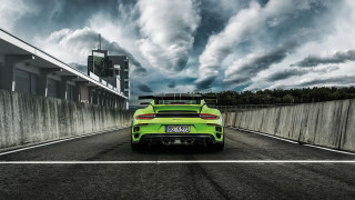 Green sports car cloudy sky - a road under a cloudy sky free wallpaper