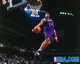 Man purple uniform dunking basketball - visionary free wallpaper
