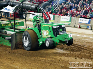 Tractor pulling equipment dirt field - a dirt field free wallpaper