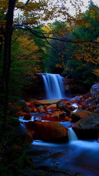 Waterfall woods rocks trees dusk - a waterfall free wallpaper for mobile