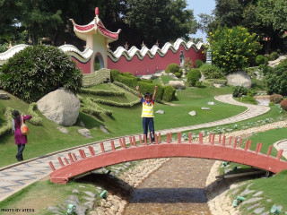 Woman standing bridge park red - symmetric free wallpaper