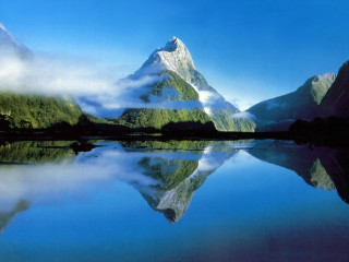 Mountain range reflection still lake 3 - a still lake free wallpaper