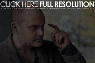 Man pointing side face hand - the side of his face free wallpaper