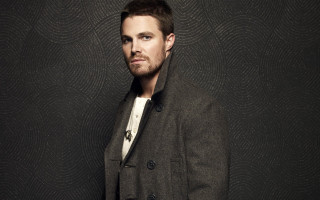 Man coat standing black wall 2 - a black wall free wallpaper