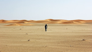 Person desert sand dunes clear - the middle of a desert free wallpaper